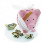 Piggy Bank with bandages, surrounded by crumpled dollar bills